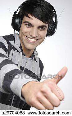 Banco de Imagem - jovem,  escutar, 
 música,  fones. 
fotosearch - busca 
de fotos, imagens 
e clipart