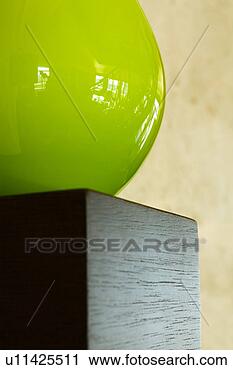 Stock Photography - detail of green 
orb on wood shelf. 
fotosearch - search 
stock photos, 
pictures, images, 
and photo clipart