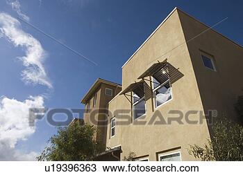 Stock Photo - exterior shot 
of contemporary 
stucco condominiums/homes. 
fotosearch - search 
stock photos, 
pictures, images, 
and photo clipart