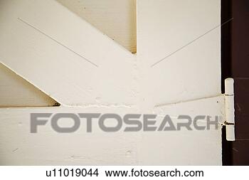 Stock Photo - detail of traditional 
red and white 
barn door. fotosearch 
- search stock 
photos, pictures, 
images, and photo 
clipart