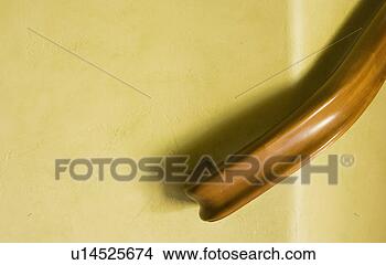 Stock Photo - detail of staircase 
railing on yellow 
wall. fotosearch 
- search stock 
photos, pictures, 
images, and photo 
clipart