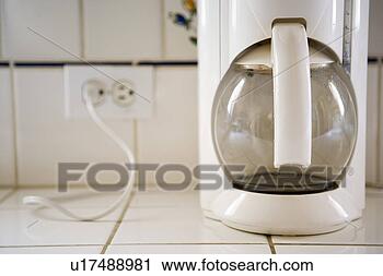 Stock Photography - detail of automatic 
coffee maker and 
cord. fotosearch 
- search stock 
photos, pictures, 
images, and photo 
clipart