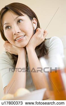 Stock Photo - woman resting 
her chin in her 
hands. fotosearch 
- search stock 
photos, pictures, 
images, and photo 
clipart