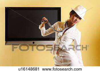 Stock Photography - fashionable young 
woman posing with 
hat and necktie. 
fotosearch - search 
stock photos, 
pictures, images, 
and photo clipart