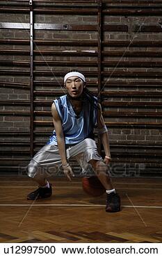 Stock Photography - young man playing 
basketball. fotosearch 
- search stock 
photos, pictures, 
images, and photo 
clipart