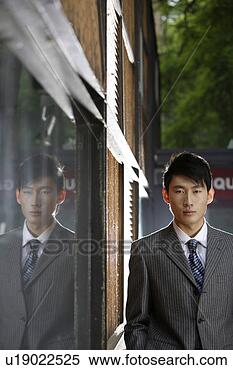 Stock Image - a portrait of 
business man and 
his shadow in 
mirror. fotosearch 
- search stock 
photos, pictures, 
images, and photo 
clipart