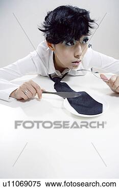 Stock Image - young women cutting 
necktie with knife 
and fork. fotosearch 
- search stock 
photos, pictures, 
images, and photo 
clipart