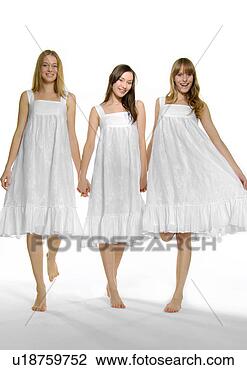 Stock Photo - portrait of three 
young women standing 
with holding each 
other's hands. 
fotosearch - search 
stock photos, 
pictures, images, 
and photo clipart