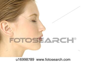 Stock Photograph - close-up of a 
young woman with 
her eyes closed. 
fotosearch - search 
stock photos, 
pictures, images, 
and photo clipart