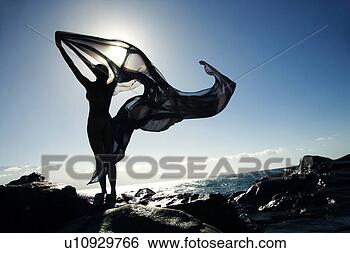 Stock Photo - filipino young 
nude woman standing 
on rocky beach 
sihouetted against. 
fotosearch - search 
stock photos, 
pictures, images, 
and photo clipart