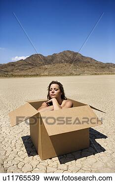 Stock Photograph - pretty nude young 
woman sitting 
in box in cracked 
desert landscape 
in. fotosearch 
- search stock 
photos, pictures, 
images, and photo 
clipart