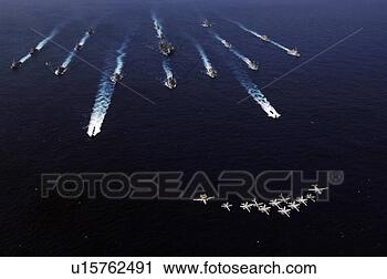 Stock Photography - us navy aircraft 
fly over a formation 
of us and japanese 
ships. fotosearch 
- search stock 
photos, pictures, 
images, and photo 
clipart