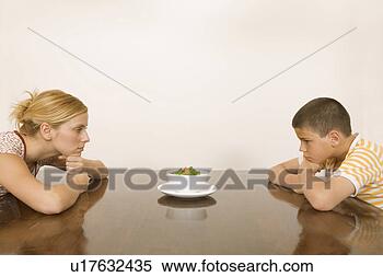 Stock Image - woman and boy 
looking at salad 
bowl. fotosearch 
- search stock 
photos, pictures, 
images, and photo 
clipart