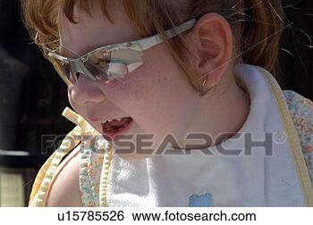 Stock Photo - adorable little 
girl with multiple 
disabilities enjoying 
a day outside. 
fotosearch - search 
stock photos, 
pictures, images, 
and photo clipart