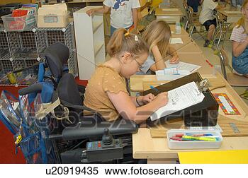 Stock Image - girl,  with multiple 
physical disabilities, 
 doing her school 
work in. fotosearch 
- search stock 
photos, pictures, 
images, and photo 
clipart