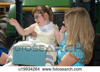 Stock Photo - little girl with 
multiple disabilities 
having a blast 
at a community. 
fotosearch - search 
stock photos, 
pictures, images, 
and photo clipart