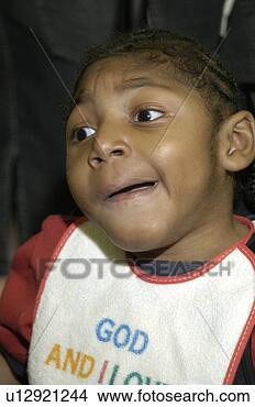 Stock Photo - interesting expression/face 
of a little boy 
with multiple 
disabilities. 
fotosearch - search 
stock photos, 
pictures, images, 
and photo clipart