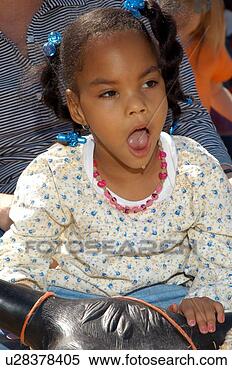 Stock Image - little girl with 
multiple disabilities 
riding a. fotosearch 
- search stock 
photos, pictures, 
images, and photo 
clipart