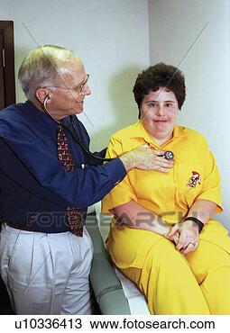 Stock Photo - woman with a disability 
undergoing a routine 
physical. fotosearch 
- search stock 
photos, pictures, 
images, and photo 
clipart