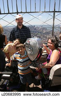 Stock Image - a family of four 
having fun on 
vacation. fotosearch 
- search stock 
photos, pictures, 
images, and photo 
clipart