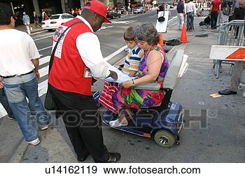 Stock Photograph - mother and sons 
getting directions 
from a guide in 
new york city. 
fotosearch - search 
stock photos, 
pictures, images, 
and photo clipart