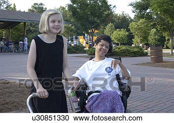 Stock Photography - two girls with 
disabilities just 
hanging out and 
having a great 
time. fotosearch 
- search stock 
photos, pictures, 
images, and photo 
clipart