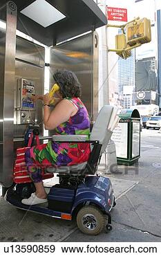 Stock Photograph - woman with a disability, 
 utilizing a scooter 
for mobility, 
 checking. fotosearch 
- search stock 
photos, pictures, 
images, and photo 
clipart