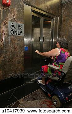 Stock Photograph - woman going into 
an accessible 
bathroom. fotosearch 
- search stock 
photos, pictures, 
images, and photo 
clipart