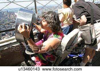 Stock Photo - woman with muscular 
dystrophy utilizing 
a scooter/cart 
for mobility. 
fotosearch - search 
stock photos, 
pictures, images, 
and photo clipart