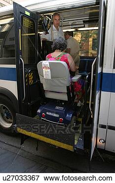 Picture - woman using a 
scooter/cart for 
mobility getting 
on a city bus 
via a. fotosearch 
- search stock 
photos, pictures, 
images, and photo 
clipart