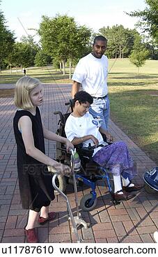 Stock Photography - young woman with 
a disability spending 
time in the park 
with her. fotosearch 
- search stock 
photos, pictures, 
images, and photo 
clipart
