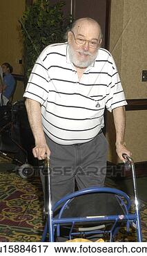 Picture - older man with 
physical disabilities 
utilizing a walker 
for mobility. 
fotosearch - search 
stock photos, 
pictures, images, 
and photo clipart