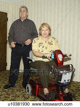 Stock Photography - woman with a disability, 
 utilizing a scooter 
for mobility. 
fotosearch - search 
stock photos, 
pictures, images, 
and photo clipart