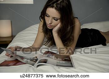 Stock Image - woman reading 
magazine. fotosearch 
- search stock 
photos, pictures, 
images, and photo 
clipart