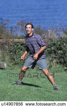 Stock Photo - caucasian man 
waiting for a 
frisbee to come 
his way. fotosearch 
- search stock 
photos, pictures, 
images, and photo 
clipart
