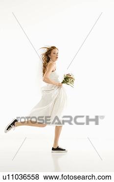 caucasian-bride-running_~u11036558.jpg