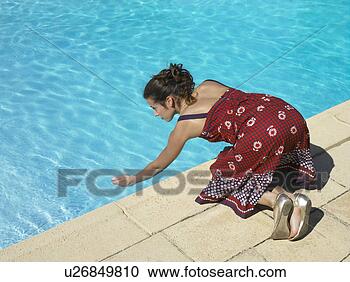 girl-testing-pool_~u26849810.jpg