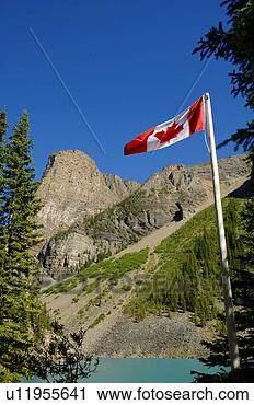 Stock Photography - canadian flag 
with mountains 
in background. 
fotosearch - search 
stock photos, 
pictures, images, 
and photo clipart