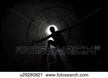 Stock Photography - person in tunnel. 
fotosearch - search 
stock photos, 
pictures, images, 
and photo clipart