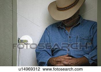 Stock Photo - cowboy in the 
outhouse. fotosearch 
- search stock 
photos, pictures, 
images, and photo 
clipart