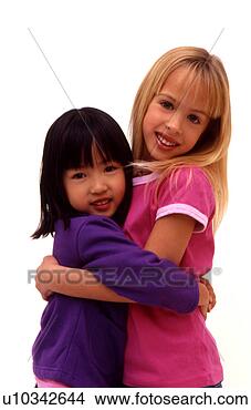 Stock Photo - two girls hugging 
each other. fotosearch 
- search stock 
photos, pictures, 
images, and photo 
clipart