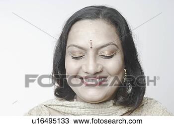Stock Photo - close-up of a 
mature woman with 
her eyes closed 
smiling. fotosearch 
- search stock 
photos, pictures, 
images, and photo 
clipart