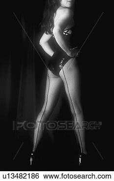 Stock Photo - woman dressed 
in black standing, 
rear view, black 
and white. fotosearch 
- search stock 
photos, pictures, 
images, and photo 
clipart