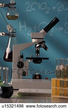 Stock Photo - microscope and 
beakers sitting 
on table in science 
classroom. fotosearch 
- search stock 
photos, pictures, 
images, and photo 
clipart