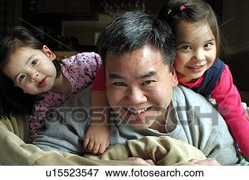 Picture - asian dad playing 
with his daughters. 
fotosearch - search 
stock photos, 
pictures, images, 
and photo clipart