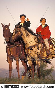 Stock Photo - father and son 
riding horses 
together. fotosearch 
- search stock 
photos, pictures, 
images, and photo 
clipart