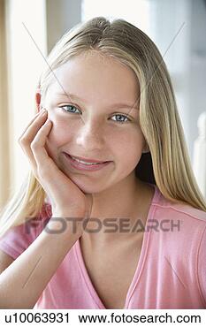 Stock Photography - portrait of caucasian 
pre-teen girl 
looking at viewer 
resting chin in. 
fotosearch - search 
stock photos, 
pictures, images, 
and photo clipart