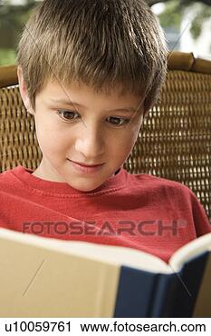 Stock Photography - caucasian pre-teen 
boy reading book. 
fotosearch - search 
stock photos, 
pictures, images, 
and photo clipart