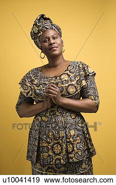 Stock Photograph - african american 
female mature 
adult in african 
dress. fotosearch 
- search stock 
photos, pictures, 
images, and photo 
clipart