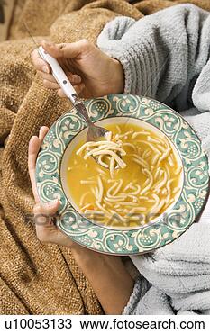 Stock Photo - bowl of chicken 
noodle soup held 
in caucasian/hispanic 
hands. fotosearch 
- search stock 
photos, pictures, 
images, and photo 
clipart